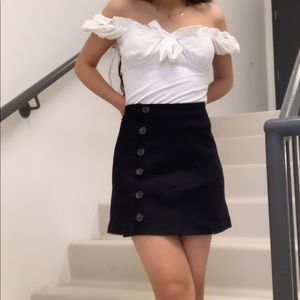 Black jean mini skirt with buttons